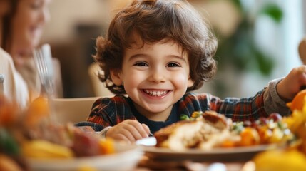 Young child with radiant smile at lively dinner table.