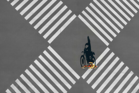 View of a big junction with zebra crossing and a lone motorcycle, Yurakucho, Tokyo, Japan.