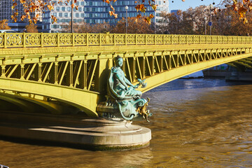 Beautiful architectural details of Mirabeau bridge over the Seine on a bright fall day in Paris, France.