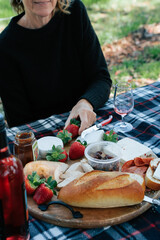 A country picnic in Western Australia with wine, bread and locally bought farm fresh produce