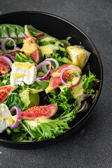 fig salad green lettuce, figs, soft cheese fresh meal food snack on the table copy space food background rustic top view keto or paleo diet vegetarian vegan food