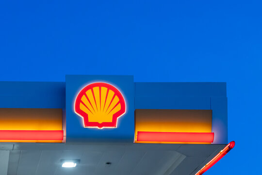 Pearland, TX, USA - April 12, 2024: A Shell logo on the building at a gas station at night in Pearland, TX. Shell Oil Company is an affiliate of the Royal Dutch Shell plc.
