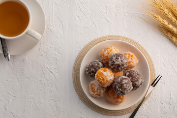 Kanom Kai Hong, a kind of Thai dessert made from rice flour Stuffed with Mung Bean and coated with sugar.Thai snack food (Swan Eggs Dessert).Top view with copy space.