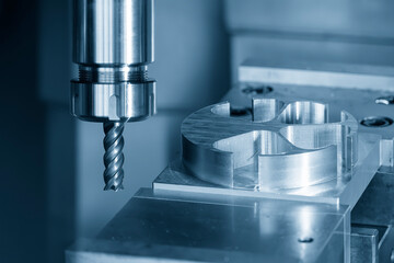 The CNC milling machine cutting the aluminum parts by solid flat nose end mill tool.