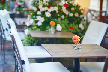 Outdoor street cafe in Helsinki, Finland decorated with flowers.