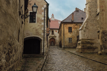 Exploring the charming cobblestone streets of Bratislava's historic district on a cloudy day