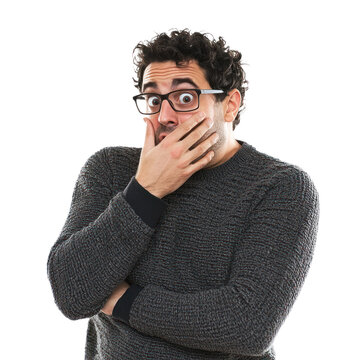 A man cowering slightly with one hand covering his mouth, eyes looking anxiously to the side isolated on transparency background
