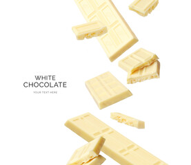 Creative layout made of white chocolate on the white background. Food concept. Macro concept.