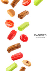 Creative layout made of colorful candies on the white background. Flat lay. Food concept. Macro concept. 