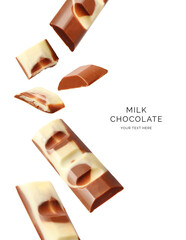 Creative layout made of milk chocolate on the white background. Food concept. Macro concept.