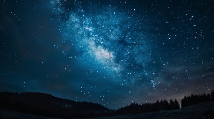 Naklejka premium lake surrounded by mountains on a starry night