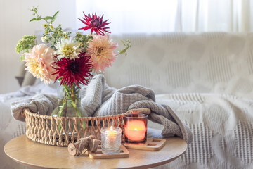 Cozy home interior with flowers dahlias. Autumn home comfort.