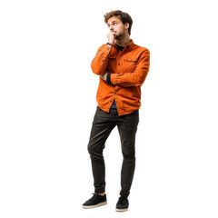 Fototapeta premium A man standing with one hand on his chin and the other tapping his foot, with a look of eager expectation isolated on transparency background