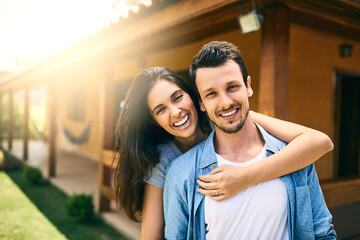 Hug, portrait and smile of couple at new home together for investment in property or real estate. Celebration, growth or love with man and woman embracing outdoor in garden of apartment for mortgage