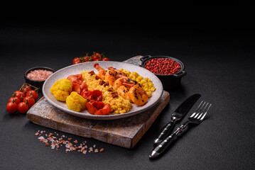 Boiled tiger shrimps with porridge, tomatoes and corn