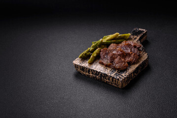 Juicy beef or pork cut into slices with boiled asparagus