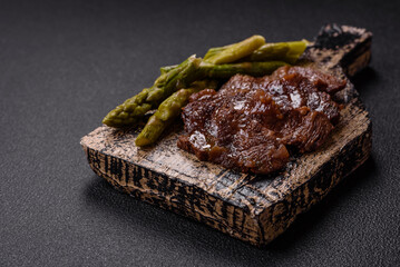 Juicy beef or pork cut into slices with boiled asparagus