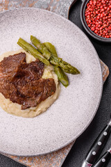 Juicy beef or pork cut into slices with boiled asparagus