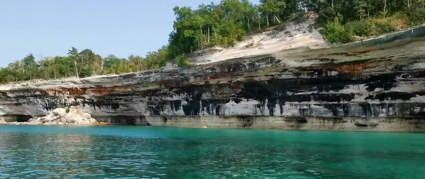 A boat tour along the cliffs to Spray Falls at Pictured Rocks National Lakeshore of Lake Superior, Munising, Michigan, USA