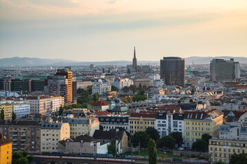 Fototapeta premium Vienna cityscape: Aerial view of Austrian capital with St. Stephen's Cathedral and urban graffiti