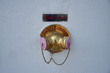 Siamese connection water divider for fire fighting on white wall