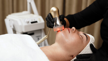 Close-up of a woman receiving an ultrasound cavitation facelift. The image captures the advanced anti-aging treatment, emphasizing the use of ultrasound technology for effective facial rejuvenation.