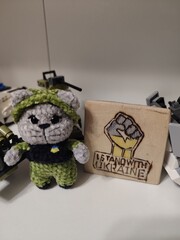 knitted plush military cat on a military base