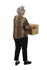 back view of senior woman holding cardboard box on white background