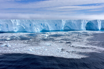 Blue iceberg and ice floe in Antarctica