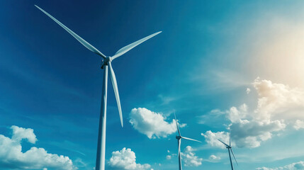 A wind farm with turbines spinning under a clear blue sky, generating clean, renewable energy
