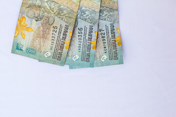 Indonesia October 13, 2024 6000 rupiah note in close up photo from top corner