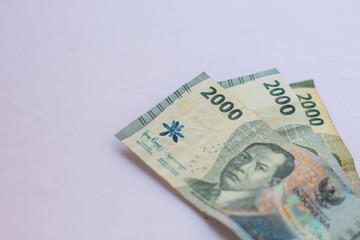 Indonesia October 13, 2024 6000 rupiah note in close up photo from top corner