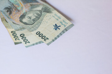 Indonesia October 13, 2024 6000 rupiah note in close up photo from top corner