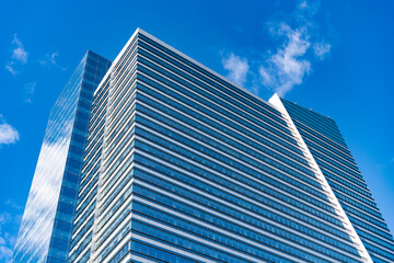 Architecture of modern glass building. Perspective city skyscraper. Modern skyscraper building. Glass building in metropolis. Skyscraper perspective view. City architecture. Glass facades