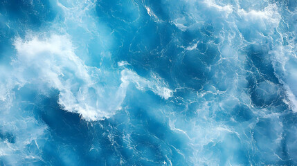 Fototapeta premium An Aerial View of the Ocean's Surface with Whitecaps and Blue Water, a Natural Abstract Background Texture