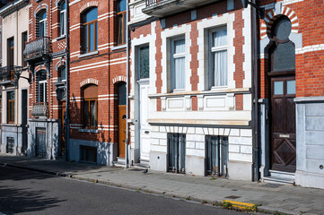 Fototapeta premium Koekelberg, Brussels, Belgium SEP 15, 2024 - Residential house facades with ornaments
