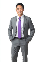 A confident Asian businessman in grey suit and purple tie stands with smile, exuding professionalism and approachability. His attire reflects modern business style, perfect for corporate settings