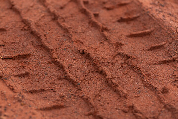 Close-up of car tire pattern on the ground,Close up of tire track or tire tread left behind in the mud or dirt