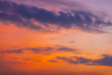 Colorful clouds and sky,Dusk, Sunset Sky Clouds in the Evening with colorful Orange, Yellow, Pink and red sunlight and Dramatic storm clouds on Twilight sky,