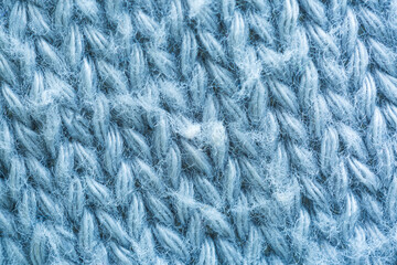 Close-up macro of grey wool fabric,white wool fabric close-up texture,Knitted warm grey sweater or scarf. Cozy composition in the home atrosphere. Wool fabric texture close up background.