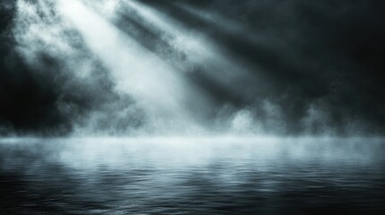 Moody foggy ocean scene with dramatic light beams and misty atmosphere
