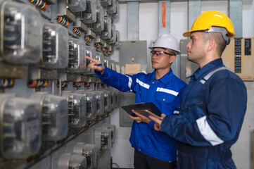 Electrical engineers and technicians work together to solve electrical system failures in...