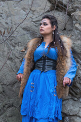 Viking warrior girl in blue in autumn