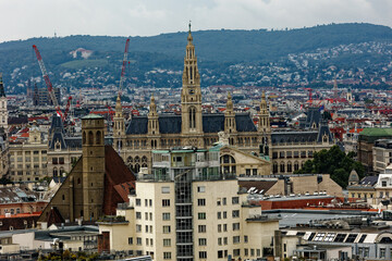 Obraz premium Time Lapse from the central tower with a view of the city of Vienna in Austria. The unique and colorful skyline combines the ancient classical and gothic with the contemporary with skyscrapers. 