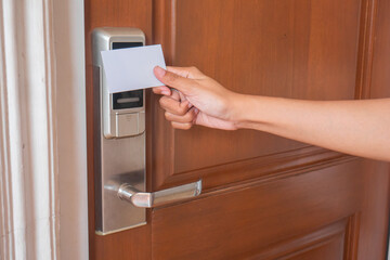 open smart door using card. female hand open the door.