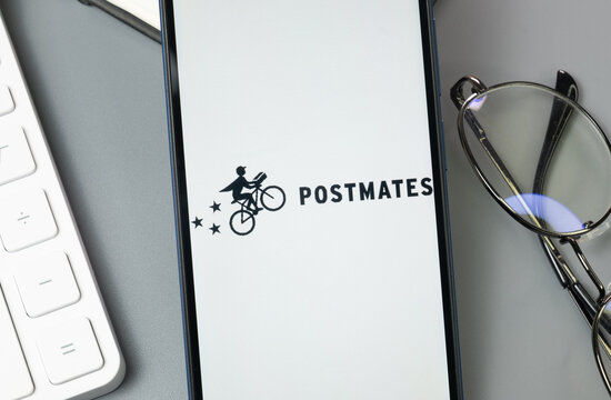 New York, USA - 30 August 2024: Postmates Logo on Phone Screen, Company Icon on Display