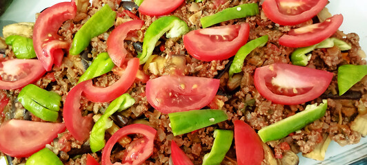 Lamb neck kebab with onions and vegetables on a tray in the hotel restaurant.