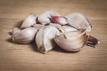 Detail of purple garlic on top of a board