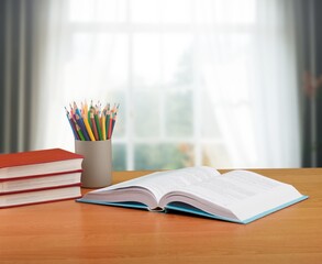 Classroom setting: school supplies placed on desk.