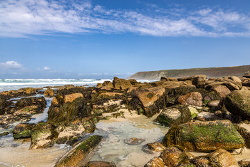 Rocks on the beach at Sennen in Cornwall, on a sunny summer's day